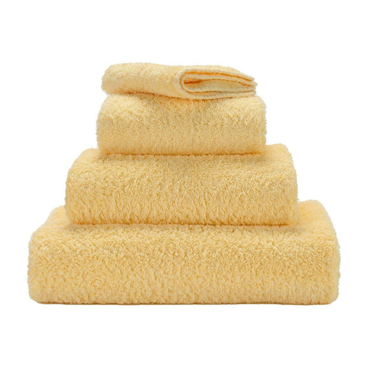 Luxusní ručník z egyptské bavlny v jemném krémově žlutém odstínu Popcorn Super Pile Abyss & Habidecor Waterfall Bathrooms