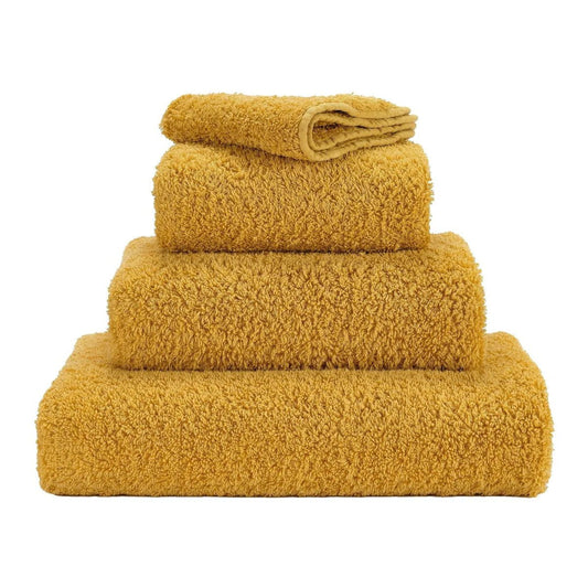 Luxusní ručník z egyptské bavlny v sytém šafránovém odstínu Safran Super Pile Abyss & Habidecor Waterfall Bathrooms